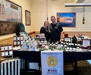 Semper Lumen Candles, LLC is all set up in the dining room! They have hand painted snowmen candles and ornaments too!! So cute!